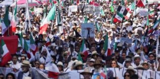 Thousands protest against government in Mexico as clashes leave 120 injured