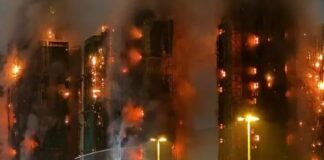 At least 13 dead after fire engulfs residential tower blocks in Hong Kong